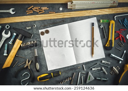 Top View of Assorted Do It Yourself DIY Tools and Blank Page Notebook as Copy Space for Home Improvement Project Planning or any Other Workshop Message.
