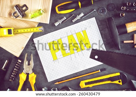 Top View of Project Plan For Home Redecoration Work with Paper, Pencil and Assorted Woodwork and Carpentry Tools on Workshop Table