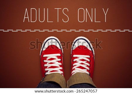 Adults Only Concept, Young Teenage Person in Red Sneakers Standing at Dividing Line of Restricted Area, top view