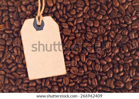 Blank Discount Vintage Price Tag Label and Coffee Beans as Textured Background, Top View