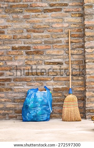 Household Used Broom For Floor Dust Cleaning and Blue Plastic Garbage Bag, vertical