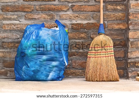 Household Used Broom For Floor Dust Cleaning and Blue Plastic Garbage Bag, Horizontal