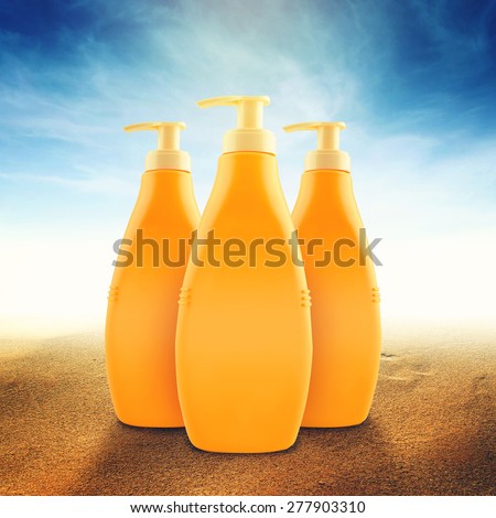 Suntan Lotion Bottles in Sand on Sunny Seaside Beach as Blank Copy Space for text or graphics
