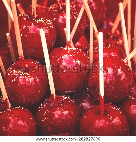Delicious Glazed Candy Apples on Sticks, Tasty Sweets Usually Sold on Street Markets and Fairs, Retro Toned Photo
