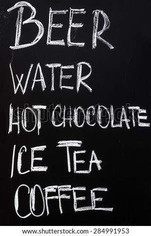 Restaurant Advertising Blackboard with Beverage Refreshment Drinks List Written in Chalk: Beer, Water, Hot Chocolate, Ice Tea, Coffee.