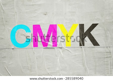 CMYK Digital Printing Technology with Cyan, Magenta, Yellow and Black Letters on Glued Poster Paper