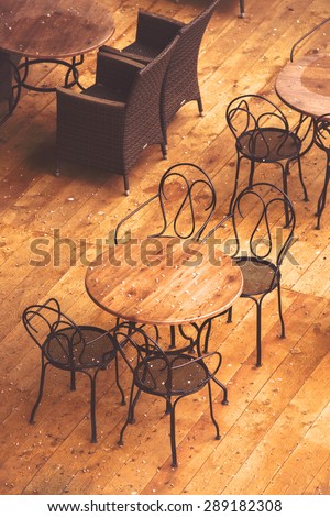 Empty Street Cafe Chairs and Tables on Terrace after the Sudden Summer Rain