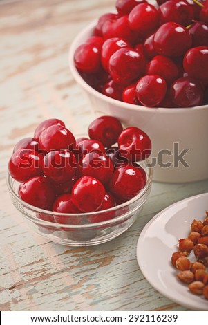 Sweet Cherry in Bowl on Rustic Table, Ripe Fresh Wild Cherries Fruit, Selective Focus, Vintage Retro Tone