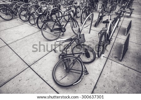 Damaged Bike on Open Street Parking for Bicycles, Urban Outdoor Setting, Retro Toned Image