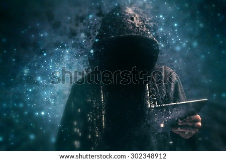 Pixelated unrecognizable faceless hooded cyber criminal man using digital tablet in deep web cyberspace