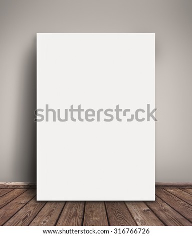 Blank Paper Poster Mock Up Leaning Against  Gray Wall as Copy Space for Design and Text.