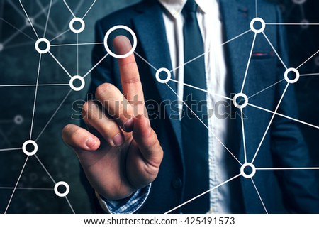 Businessman connecting the dots in business project management, social networking or teamwork organization.
