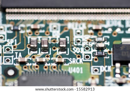 Macro shot of electronic component on electrical circuit.