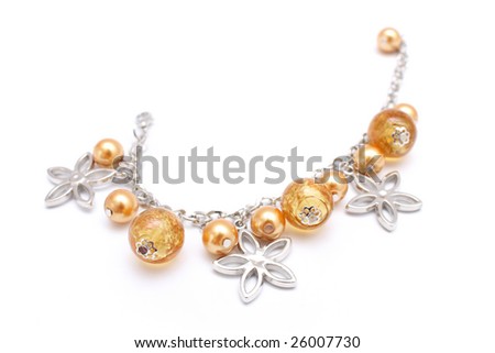 A golden beads bracelet isolated on white background.