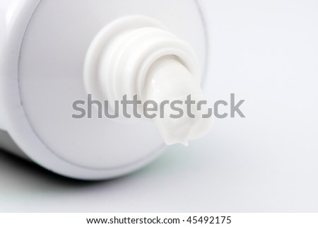 Close up of tooth paste over white background.