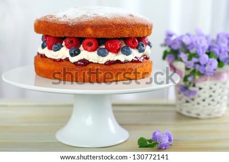Victoria sponge cake with cream and berries