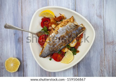 Sea bass fillet with butter beans and chorizo salad