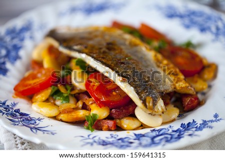 Sea bass with butter bean, chorizo and tomato salad
