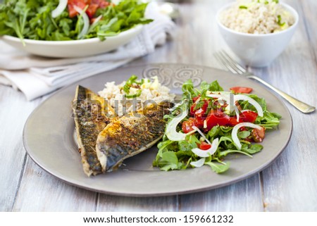 Spicy mackerel fillet with rice and salad