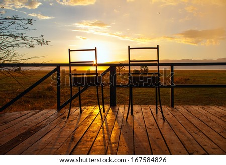 Two chairs with the sunset view in safari camp in Tanzania