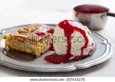 Apple cake with ice cream and raspberry sauce