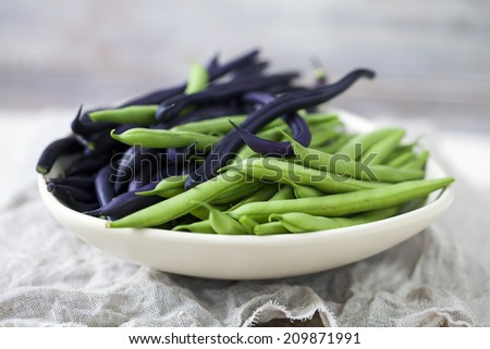 Bowl of green and purple beans