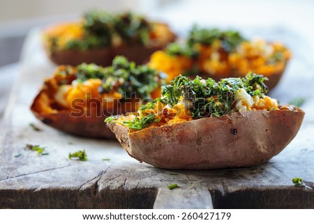 Roast sweet potato with feta cheese and crispy kale