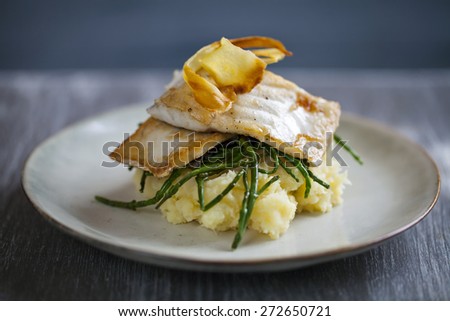 Sea bass fillet on parsnip mash and samphire with parsnip crisp