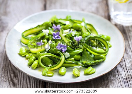 Salad with asparagus ribbons, broad beans and lilac