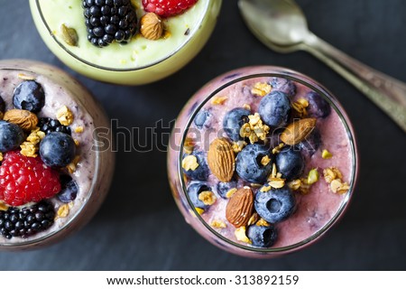 Blueberry and blackberry smoothie with almonds and granola
