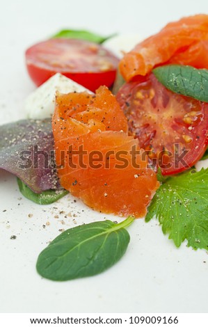 salad with smoked salmon, mozzarella and tomatoes