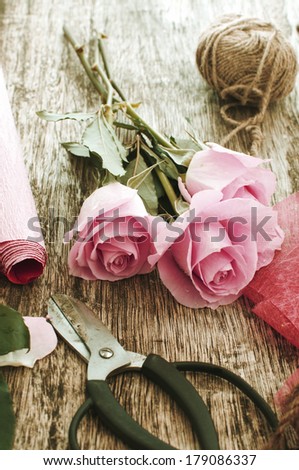 making of bouquet of pink roses in retro colors
