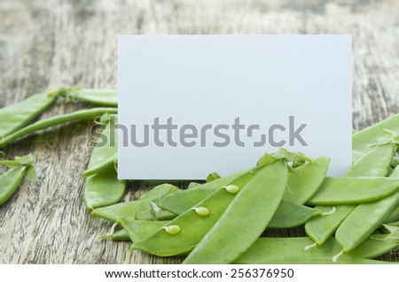pods of green pea on a white background