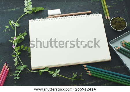 sketch book, moss and color pencils in green tones, mock up