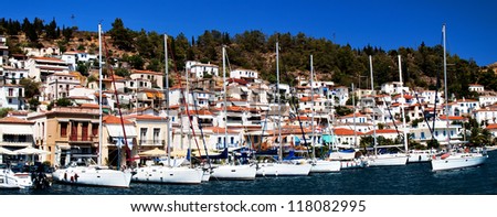 Poros Island, Saronic gulf, Greece, harbor, view from the sea. Poros is a volcanic Island formed through the union of 2 smaller islands, Kalourla and Sphaeria. The island is part of Saronic islands