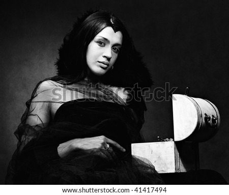 Lady in black with coffer, XIX centure style, monochrome