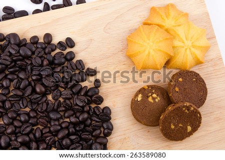 Roasted coffee beans and Chocolate cookies and Butter cookies , breakfast