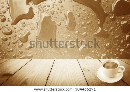 Vintage style - Abstract rain drops on a window or water drops on grass and coffee cup and wood background