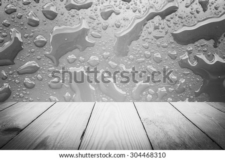 Abstract Black and White rain drops on a window or water drops on grass and wood background