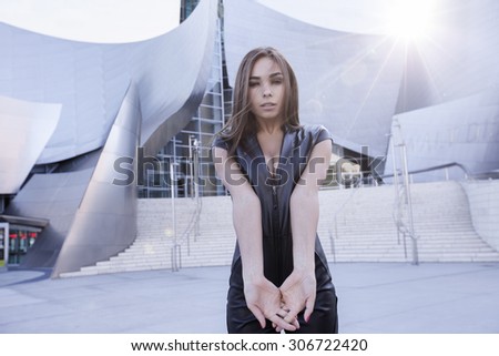 beautiful model in skin-tight dungarees. The leather suit is black color. Photoshoot was shot in Down Town of Los Angeles near Walt Disney Concert Hall. Profession model is very sexual.Califirnia