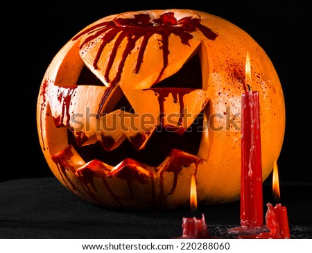 Bloody pumpkin, jack lantern, pumpkin halloween, red candles on a black background, halloween theme, pumpkin killer