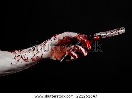 Bloody hand holds a razor, an old razor, dangerous blade, bloody razor, a maniac with a razor, a bloody knife, mad barber, black background, isolated, bloody topic, zombie theme, halloween theme