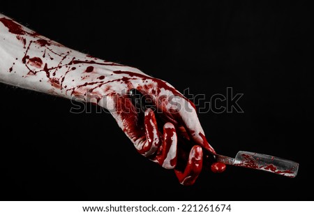 Bloody hand holds a razor, an old razor, dangerous blade, bloody razor, a maniac with a razor, a bloody knife, mad barber, black background, isolated, bloody topic, zombie theme, halloween theme