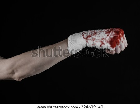 shook his bloody hand in a bandage, bloody bandage, fight club, street fight, violence, bloody theme, black background, isolated, bloody fists, boxer, tied his hands with a bandage
