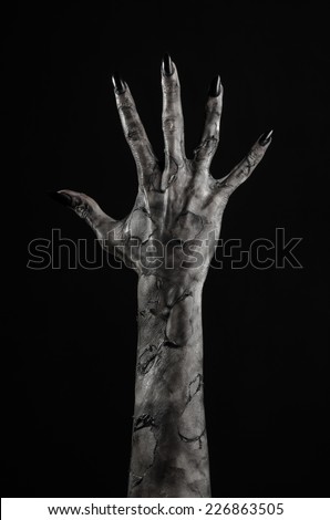 terrible zombie hands, dirty hands of the mummy, zombie theme, halloween theme, black background, isolated, black hand of death with black fingernails, monstrous art