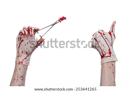 Surgery and medicine theme: doctor bloody hand in glove holding a bloody surgical clamp with swab and performs surgery on an isolated white background in studio