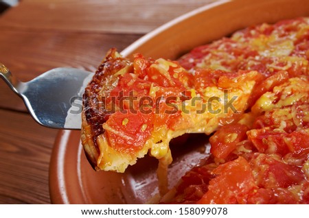 Pizza Marinara .taking slice of pizza,melted cheese dripping  closeup . farmhouse kitchen