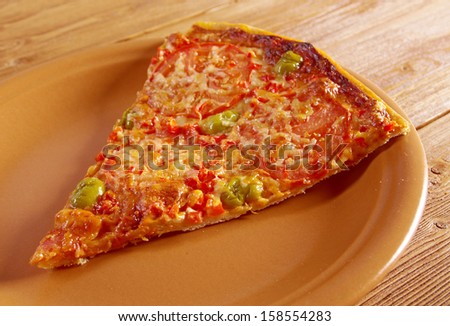 lifted slice  Pizza Marinara  closeup . farmhouse kitchen