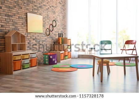 Stylish child room interior with colorful furniture