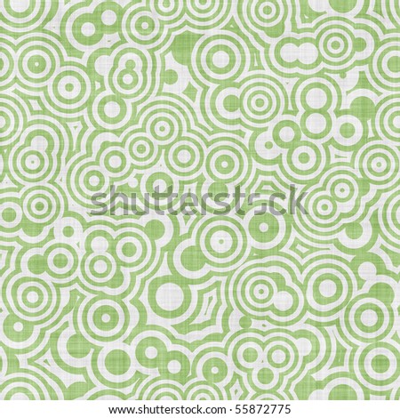 Green and white op art targets seamless background has fabric texture and faded color.